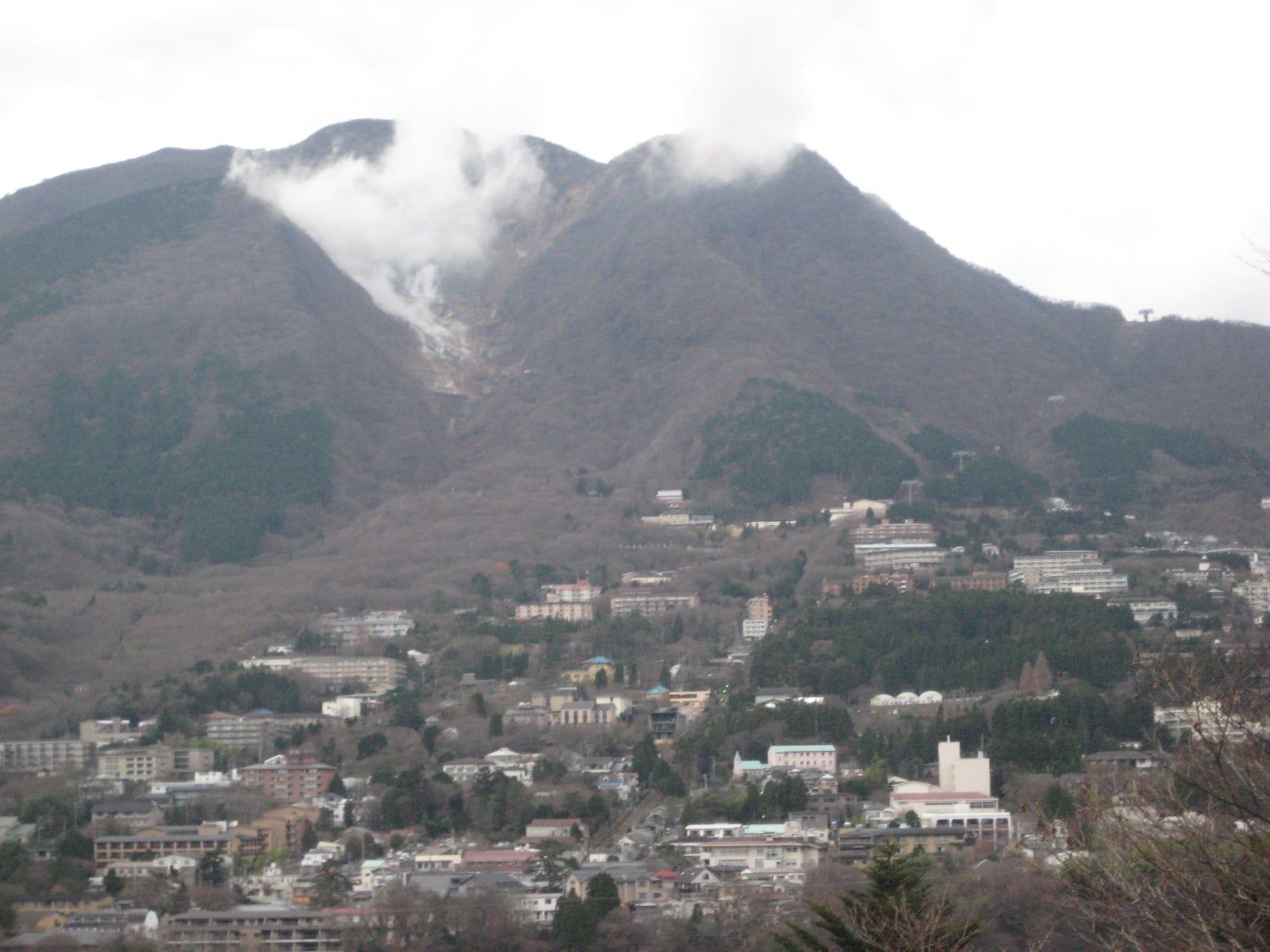 Mount Soun with volcanic steam rising above the hillside onsen town of Gora in Hakone